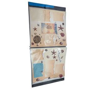 The photos appear to show a Tiny Treasures 12” x 12” Vacation Memories Scrapbook